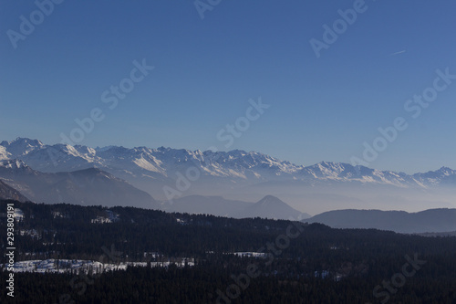 panoramic view of alpine winter snow mountains morning french europe alps savoie