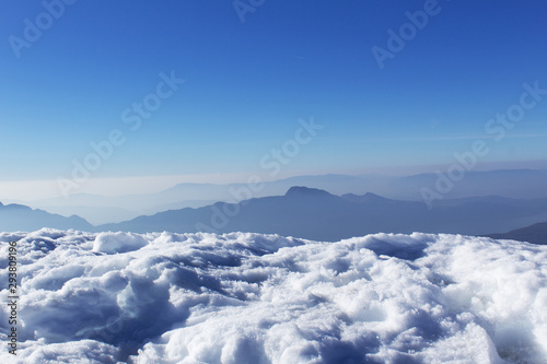 aerial view of winter snow europe alps mountains with blue and white panorama view for travel ski and sport activity