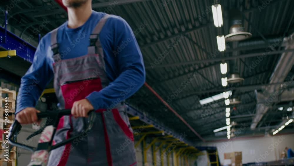 Warehouse worker with a pallet rack Warehouse worker with a pallet rack