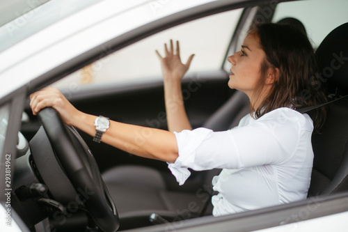 Angry young woman in car