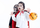 Happy Halloween asian children with basket pumpkin