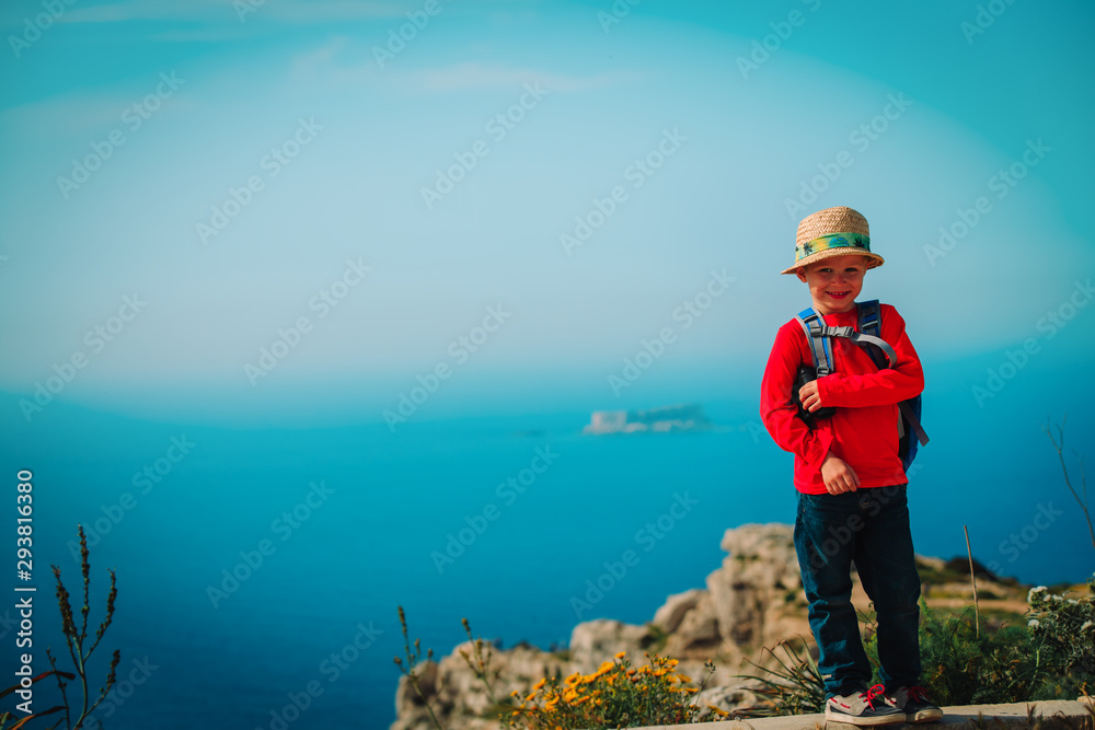little boy travel in mountains at sea, family hiking in nature