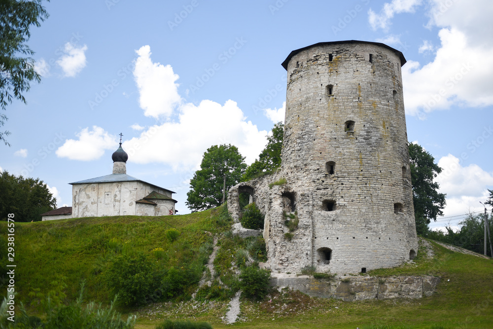 Fortress defensive tower next to the white church
