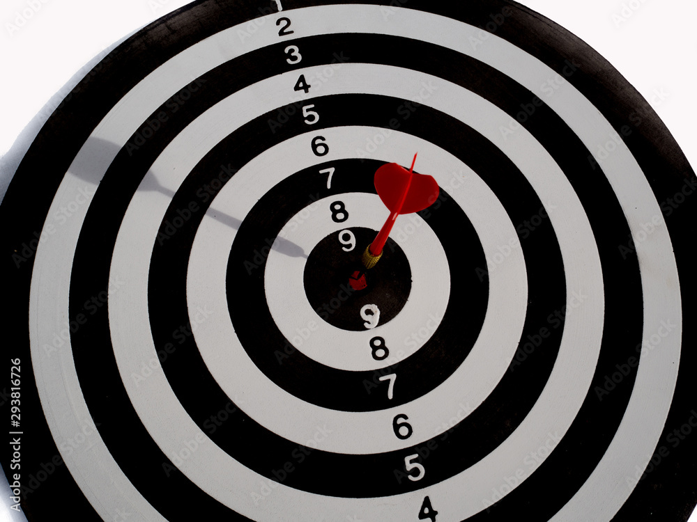 Target with red dart focus on bull's eye, Setting challenging business goals And ready to achieve the goal concept Target with red dart focus on bull's eye, Setting challenging business goals And ready to achieve the goal concept