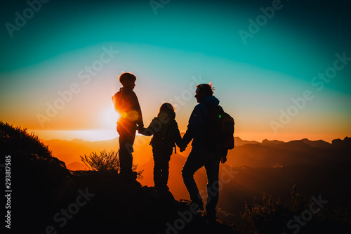 Father with kids-boy and girl- travel in sunset mountains © nadezhda1906