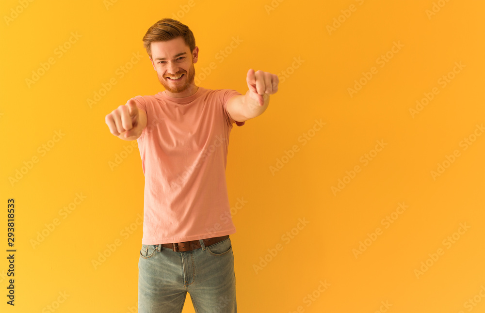 Young redhead man cheerful and smiling pointing to front Young redhead man cheerful and smiling pointing to front