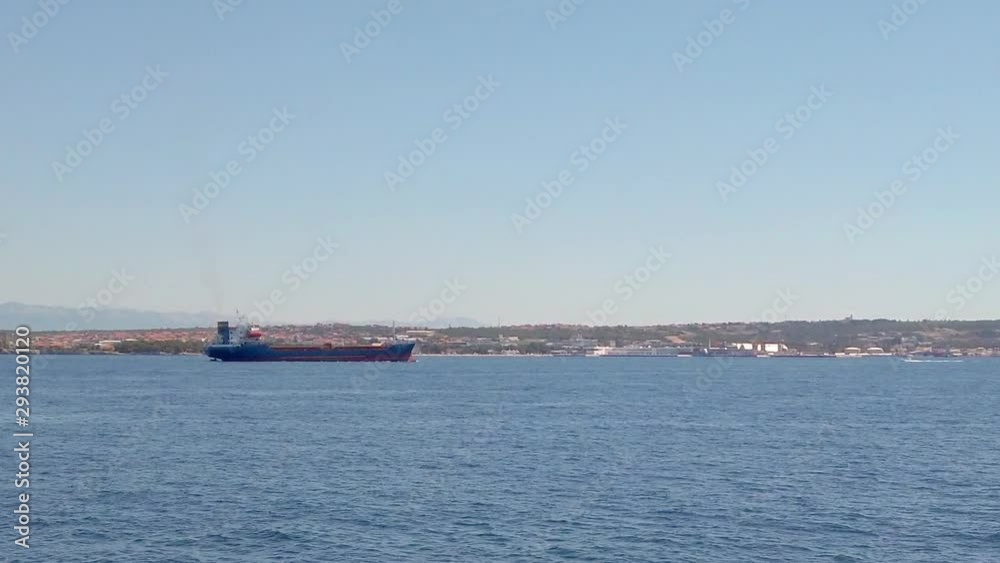 Long shot of logistic cargo ship passing by Long shot of logistic cargo ship passing by
