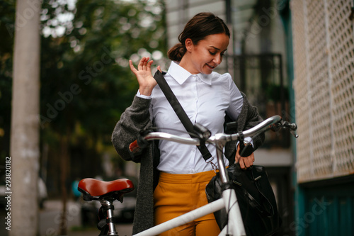 Young woman posing with her bicycle 