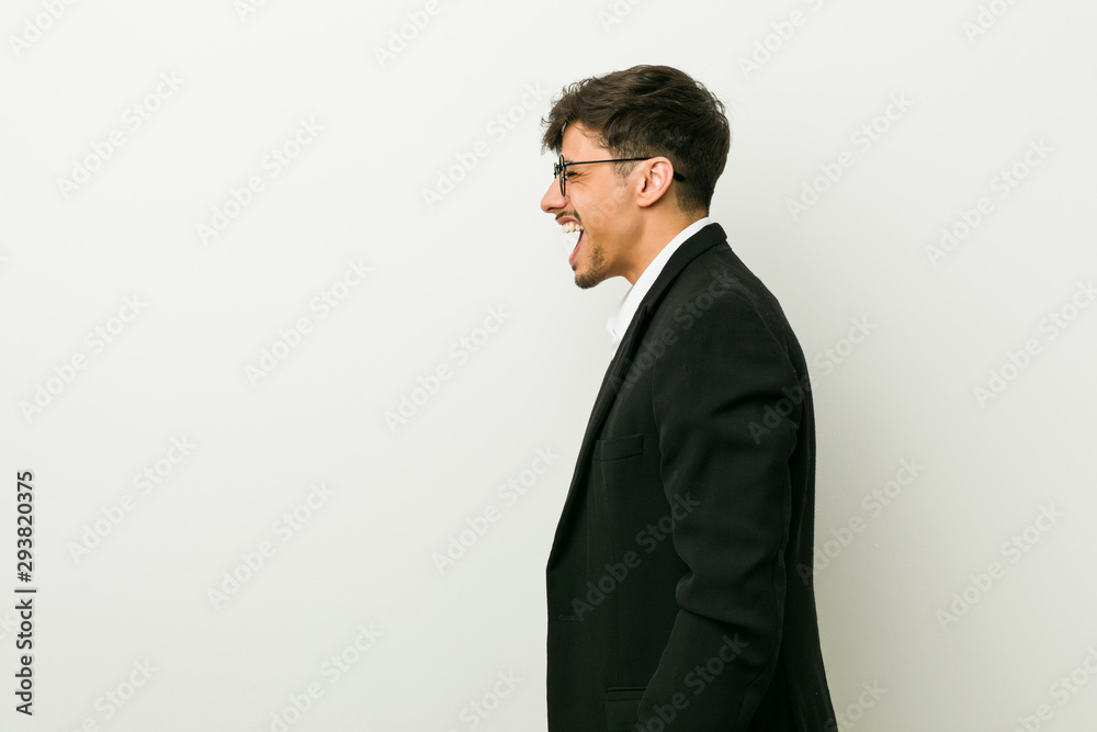 Young business hispanic man shouting towards a copy space Young business hispanic man shouting towards a copy space
