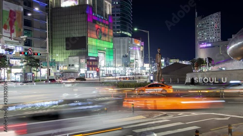 SEOUL/KOREA - MAY 29 2019: Timelapse commercial Dongdaemun district with markets and shopping centers flashing advertisement illumination in Seoul city at night zoom in on May 29 in Seoul photo