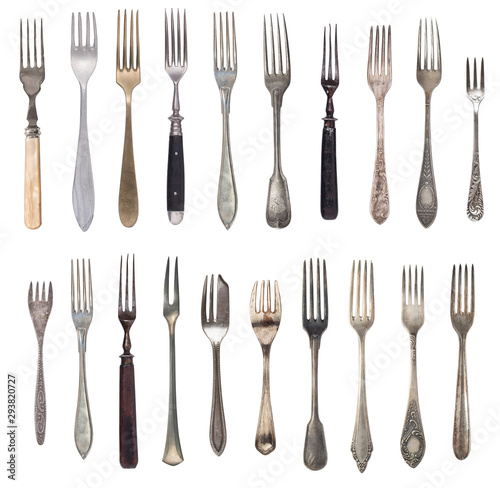 Beautiful old vintage forks isolated on white background. Top view. Retro silverware.