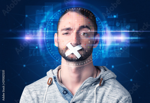 Facial recognition system. Young man on blue background