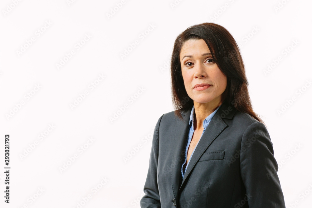 Portrait of a serious brunette businesswoman in gray suit, isolated in white studio Portrait of a serious brunette businesswoman in gray suit, isolated in white studio
