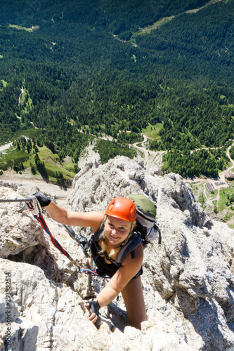 young attractive blonde female mountain climber in the Dolomites of Italy