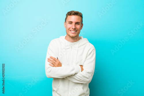 Young caucasian sport man laughing and having fun. © Asier