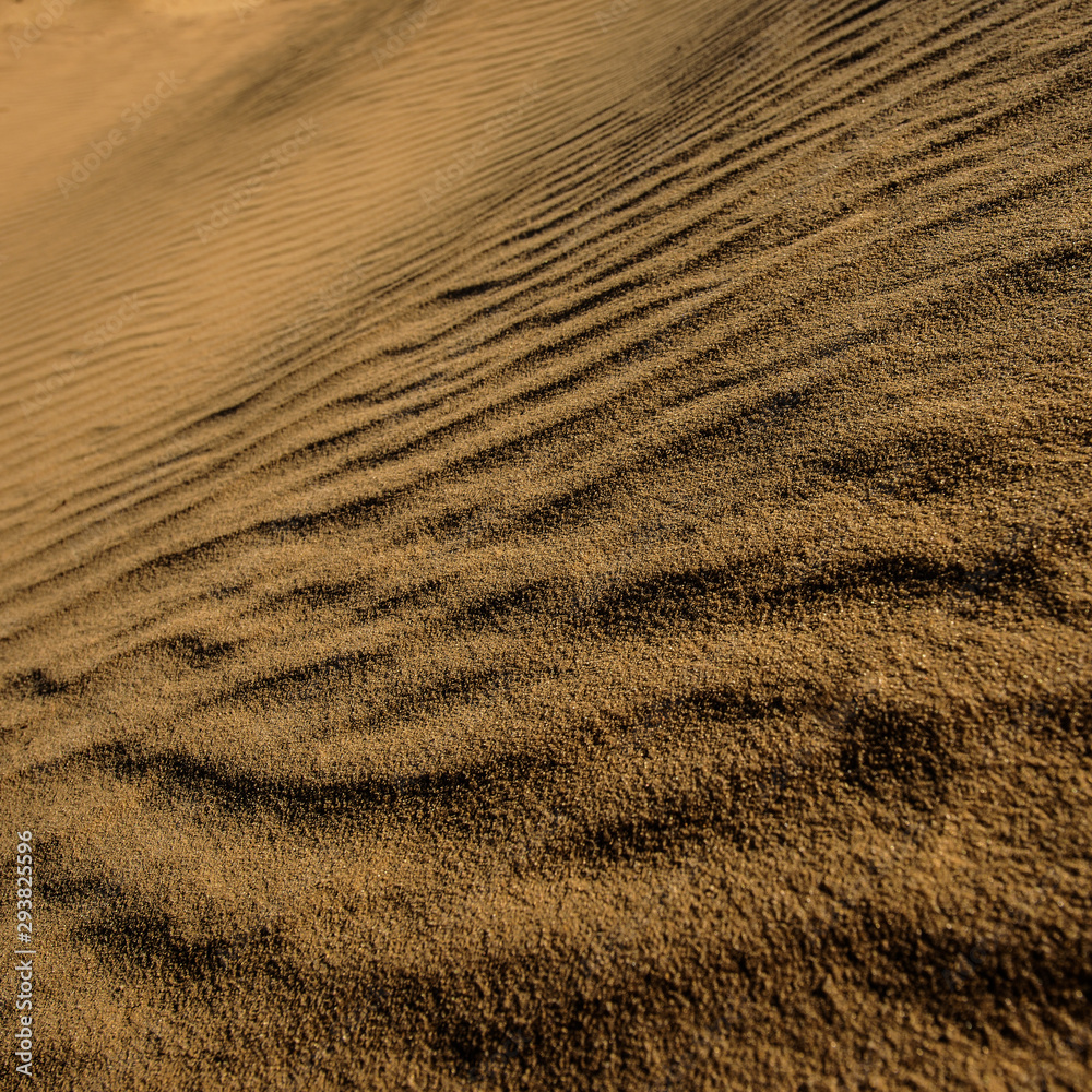 Sand surface in the dunes at sunset. Sand surface in the dunes at sunset.