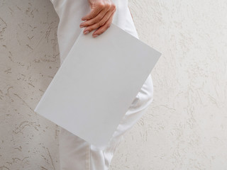 Woman holding a mock-up magazine