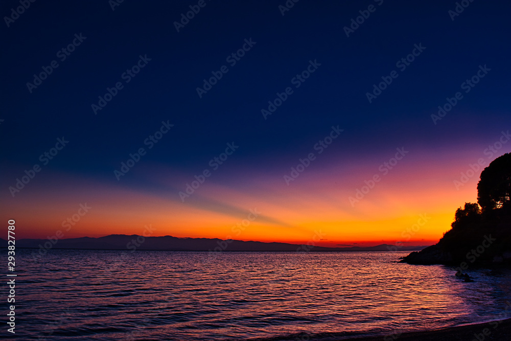 Night skyline with beautiful sunset on Mediterranean coastline, sea sunset image 
