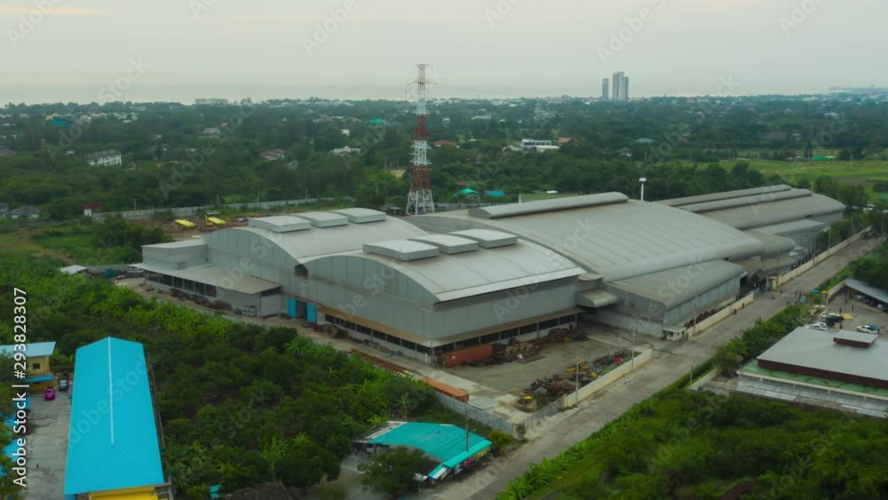 Aerial view hyperlapse (motion time lapse) of the large warehouse. The time when the employees of the company are ending work. footage video 4k.
