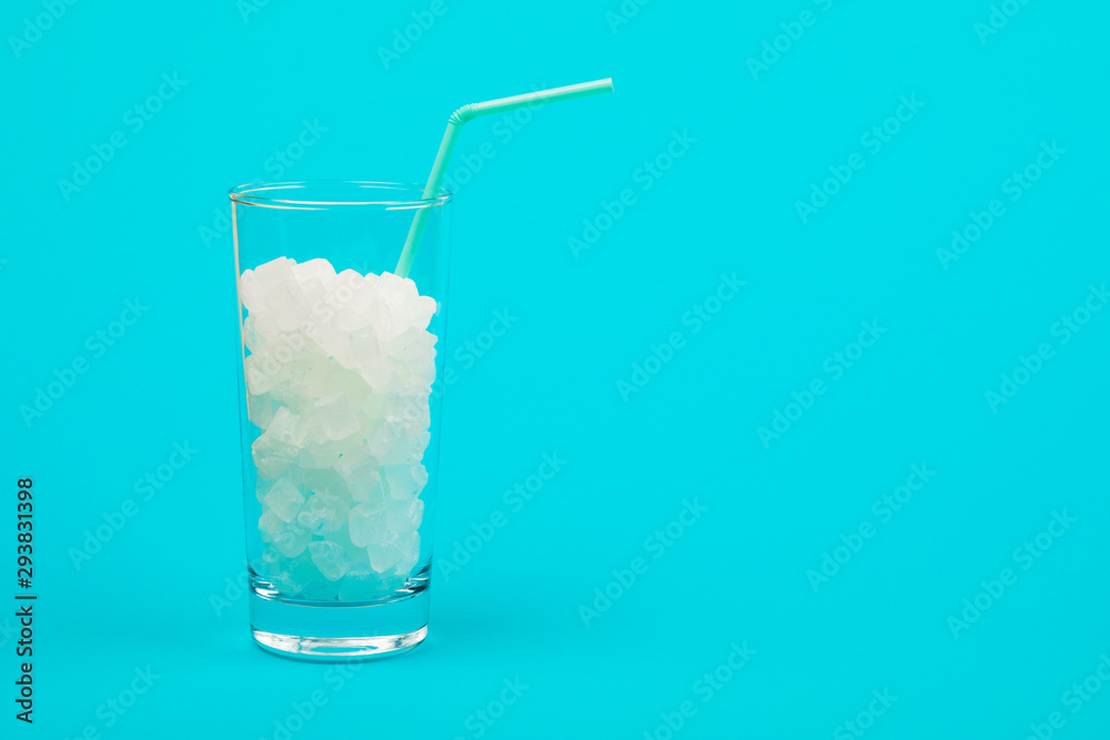 Glass of sugar. The concept of junk food. On red background. Glass of sugar. The concept of junk food. On red background.