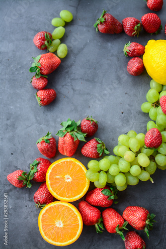 Colorful fruits and berries  on dark background