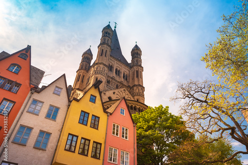 Buildings along an embankment and the High Cathedral of St. Peter in Cologne in Germany