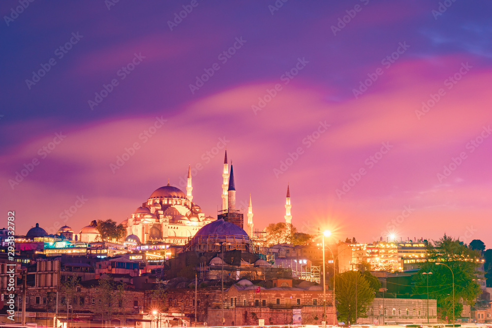 Fototapeta premium Night Suleymaniye Mosque against dramatic sky. It's an Ottoman imperial mosque located on the Third Hill of Istanbul, Turkey.