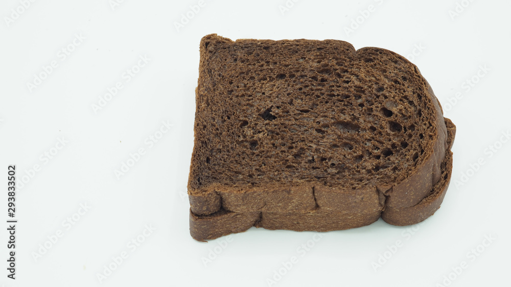 Dark cocoa bread on white background. It is a natural whole grain. Dark cocoa bread on white background. It is a natural whole grain.