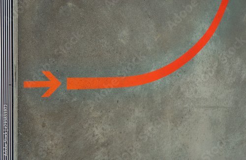 Red arrow as signpost on gray horizontal background. photo