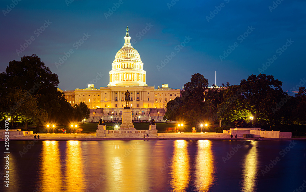 Panorama of the Capitol of the Unites States in evening light with the Capitol Reflecting Pool in the foreground.