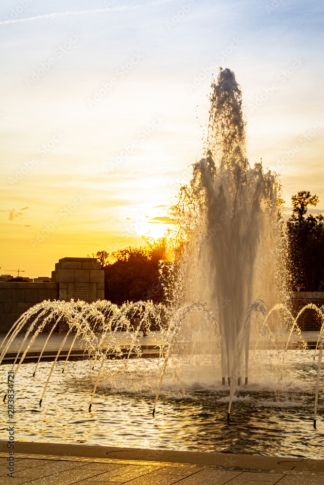 Fototapeta premium Sunset image of the water fountain at the World War II Memorial on the National Mall in Washington DC.