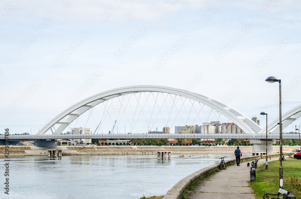 Novi Sad, Serbia - July 17. 2019: Zezelj bridge on river Danube in Novi Sad Serbia. The prospect of built New Zezelj Bridge viewed from the Petrovaradin side of the promenade