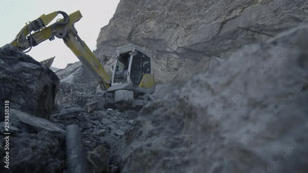 excavator on high alpine mountain rocks excavator on high alpine mountain rocks