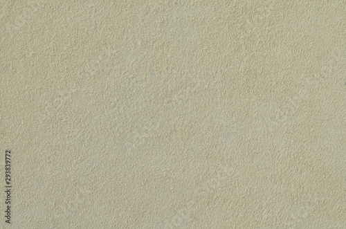 Grey suede soft leather for background. Natural texture of the suede. Space for text on the background of Shammy leather close-up. Faux suede made from polyester.