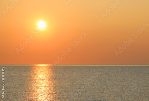 hot yellow sun over the ocean