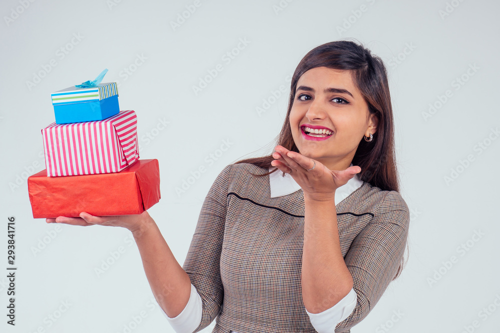 beautiful turkey woman giving gift boxes in studio white background.New year or Ekadashi concept beautiful turkey woman giving gift boxes in studio white background.New year or Ekadashi concept