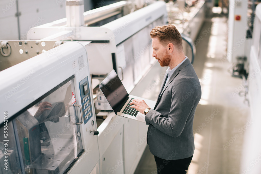 Manager checks machines at the factory. Inspector checks a factory.
