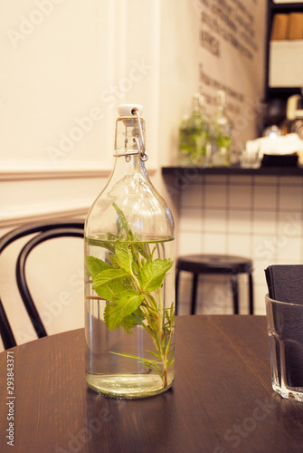 glass bottle on the table in the cafe