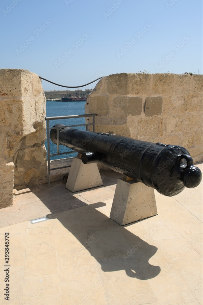 Old gun on the wall of a fort on the island of Malta.