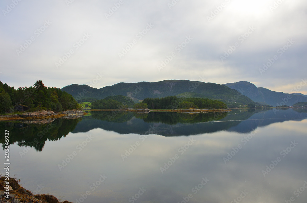 Mountains Reflection on Calm Water Fjord in Norway on Summer