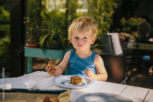 Little boy having a snack outside photo