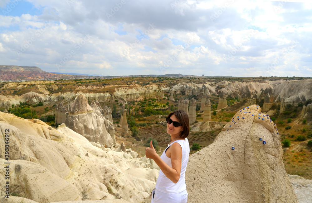 Naklejka premium Young girl traveller standing in the valley of Cappadocia Turkey.