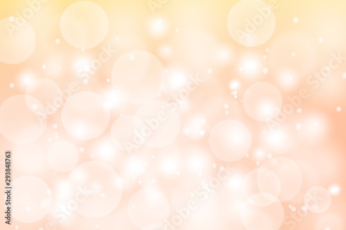 Christmas background orange pastel with bokeh, snowflakes winter blurred 