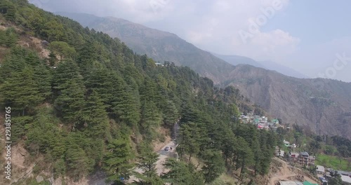 Aerial fly over above a mountain road running through Dharmasala, India. photo