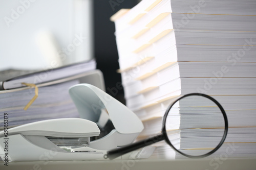 The black reading lens is on the yellow spreading insurance folder 404 error page not found overwork closeup.
