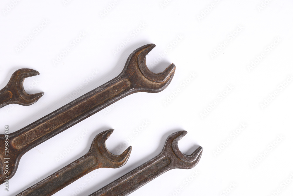 Old rusty stainless steel crescent wrench isolated on white top view Old rusty stainless steel crescent wrench isolated on white top view