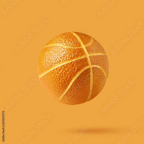 Orange basketball ball isolated on orange background with copy s