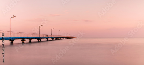 The Pontoon Bridge Mamaia at sunset.(Pasarela) Dock on the Beach photo
