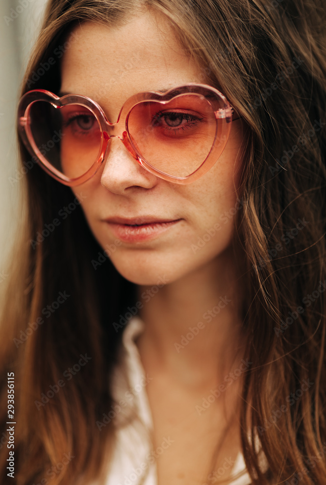 Closeup Of Young Woman With Heart Shape Glasses Closeup Of Young Woman With Heart Shape Glasses