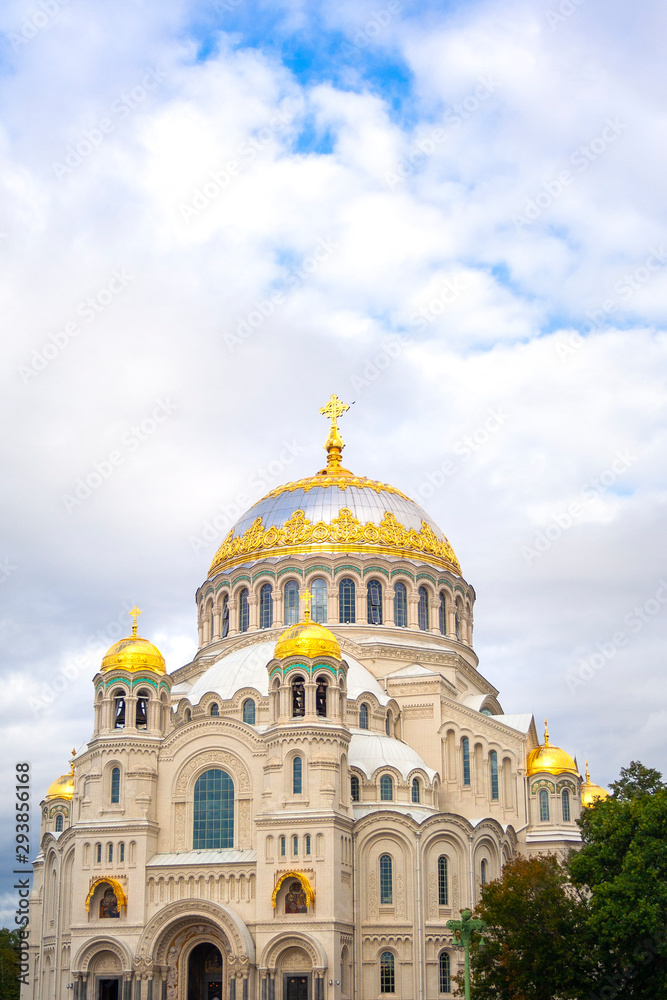 Nicholas the wonderworker's church on Anchor square in kronstadt town Saint Petersburg. Naval christian cathedral church in russia with golden dome, unesco architecture at sunny day vertical picture